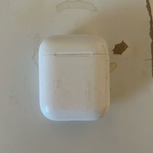 AirPods 1st generation with a burgundy silicone case